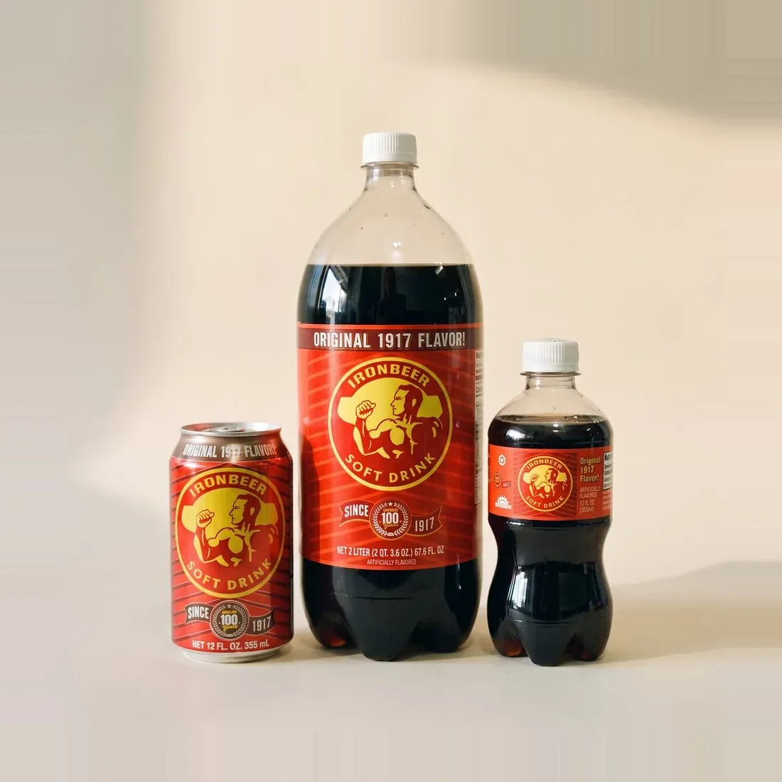Ironbeer in a 12 ounce can, a 2 liter bottle and a small bottle
